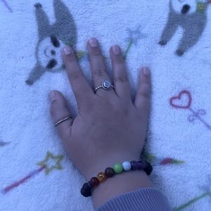 Brand: Amazon Size: Adjustable Color: Black with rainbow stones